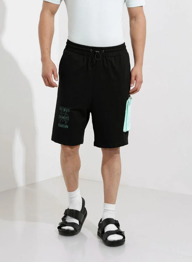 ذا انديان كراج كو Men Oversized Fit Batman Printed Side Pocket Mid-Rise Shorts